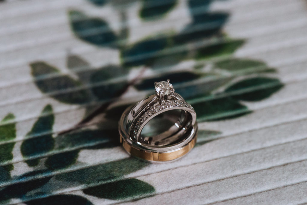 wedding rings with green leaves