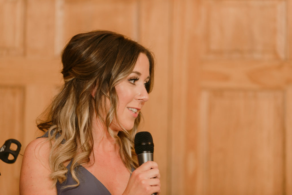 maid of honour giving speech at wedding reception