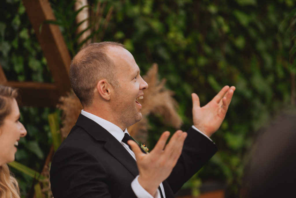 groom in shock during wedding reception speeches
