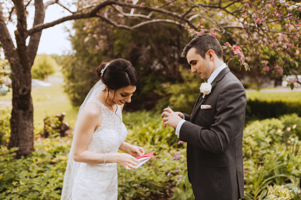 bride and groom exchanging cards from one another