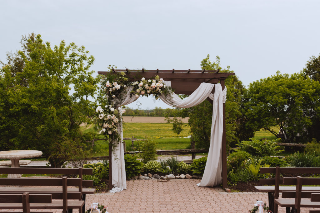 floral arch with draping