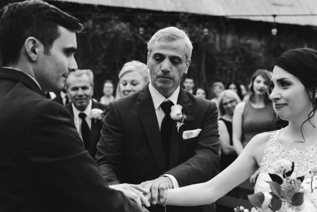 father of the bride giving away his daughter
