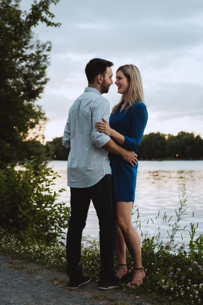 engaged couple by the canal at dows lake at sunset
