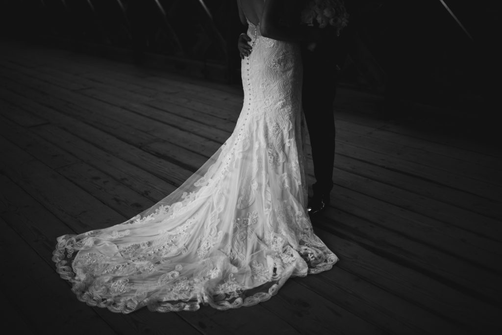 bride's lace dress glowing in the light