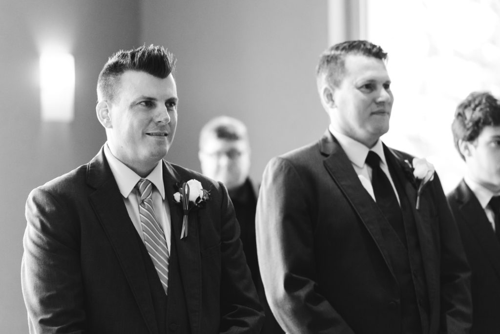 groom seeing his bride for the first time at the ceremony