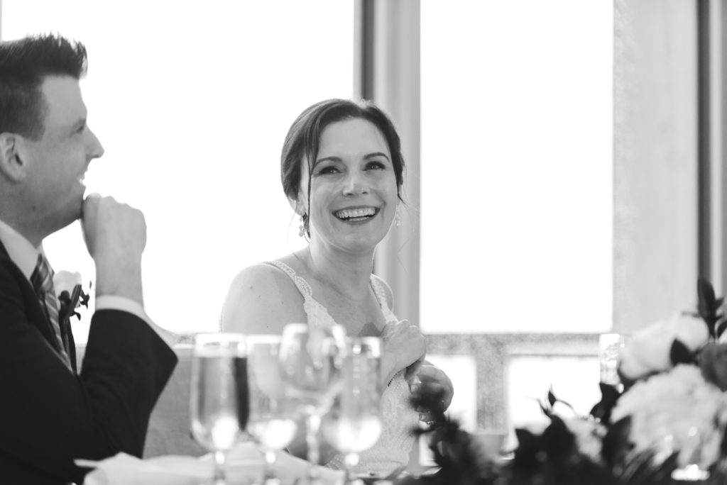 bride laughing during wedding reception at Le Belvedere