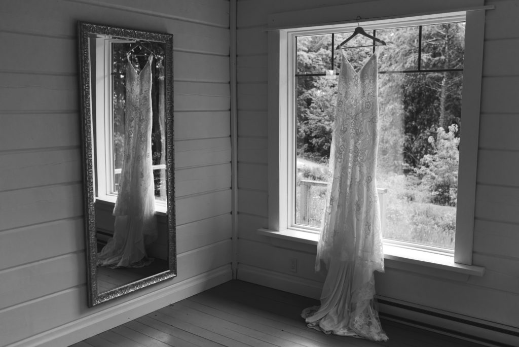 bride's dress hanging in the window at Le Belvedere guesthouse