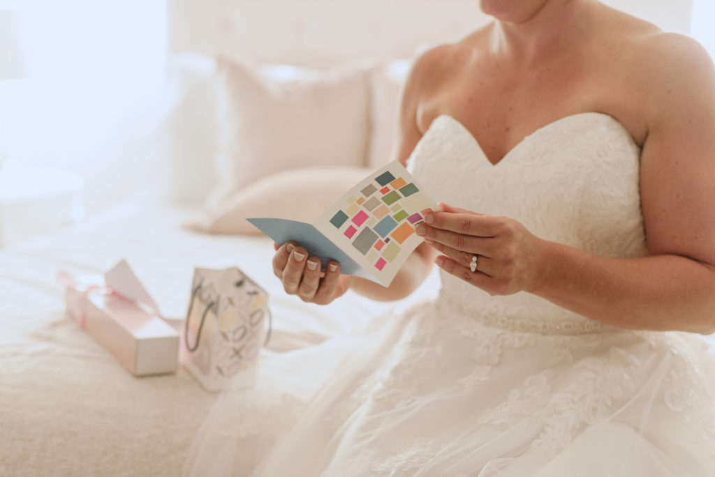 bride reading a card from her groom