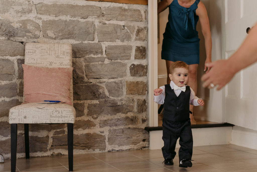 bride's son in suit running into see his mom