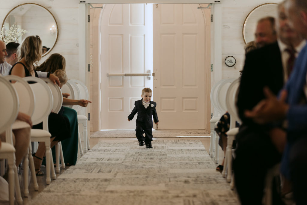 bride and groom's son walking down the aisle
