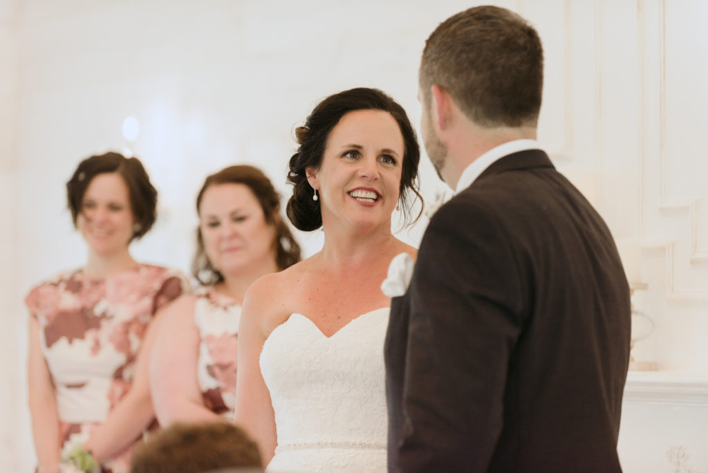 bride smiling at groom