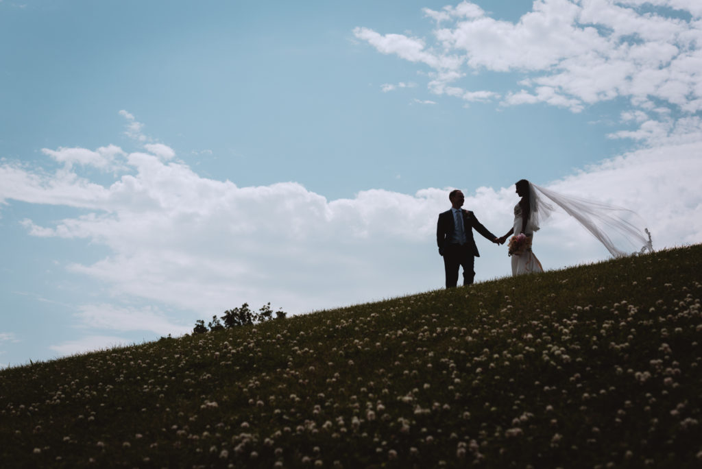 bride and groom on hill silhouette
