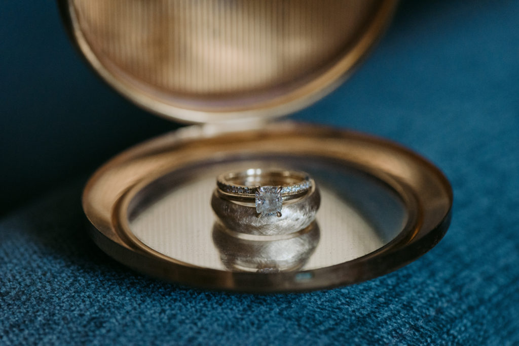 wedding rings on pocket mirror