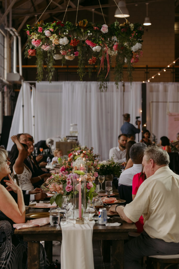 head table with hanging floral installation at horticulture building