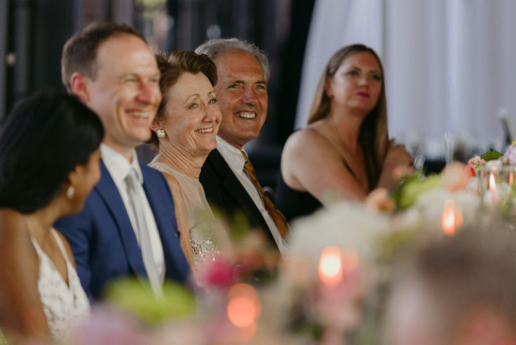 mother of the groom laughing during speeches