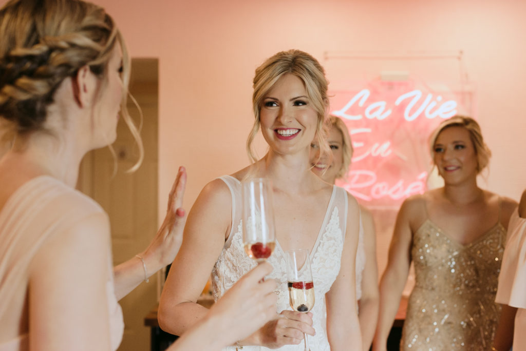 bride and bridesmaids drinking champagne at the June Motel