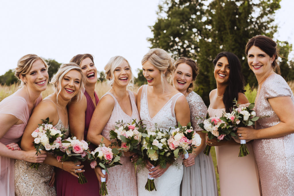 bride and bridesmaids laughing at Fields on West Lake