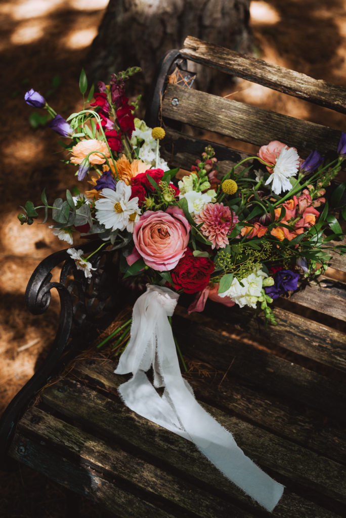 wedding bouquet on a wooden bench