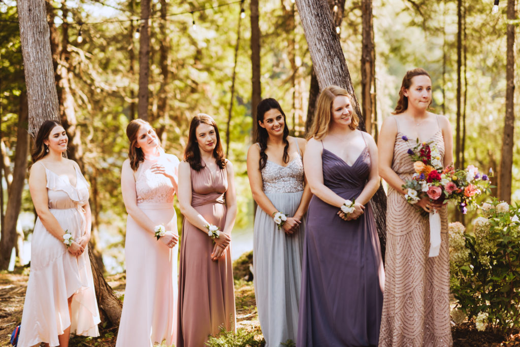 bridesmaids at cottage wedding during ceremony