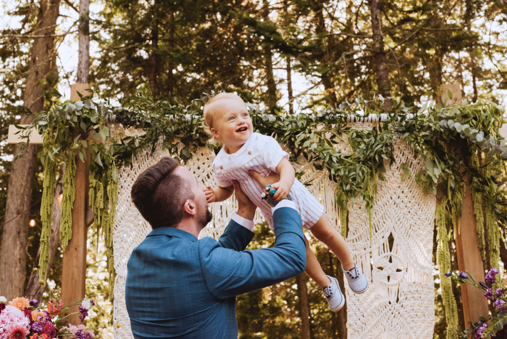 groom and his nephew laughing during cocktail hour