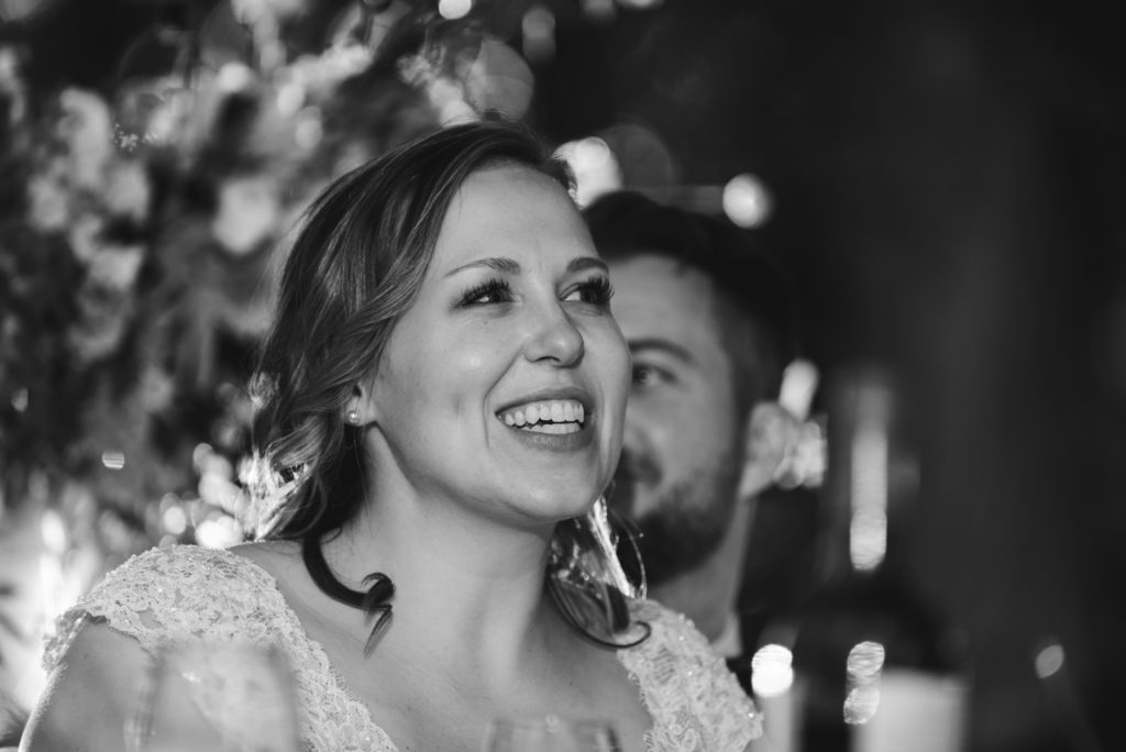 bride smiling during speeches
