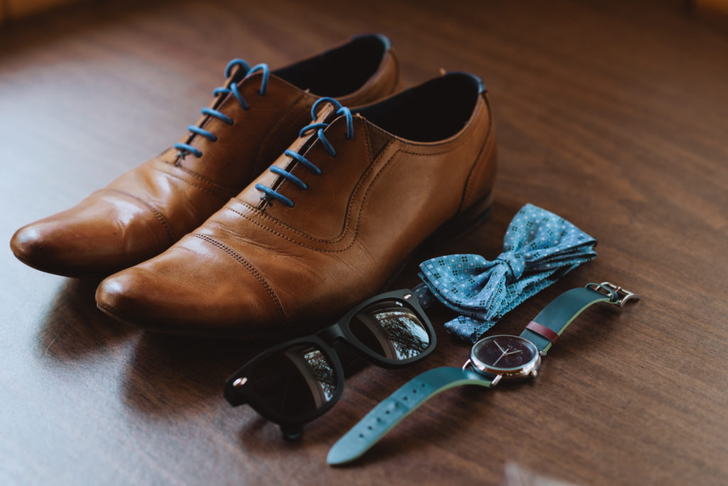 groom's shoes, watch, and bow tie