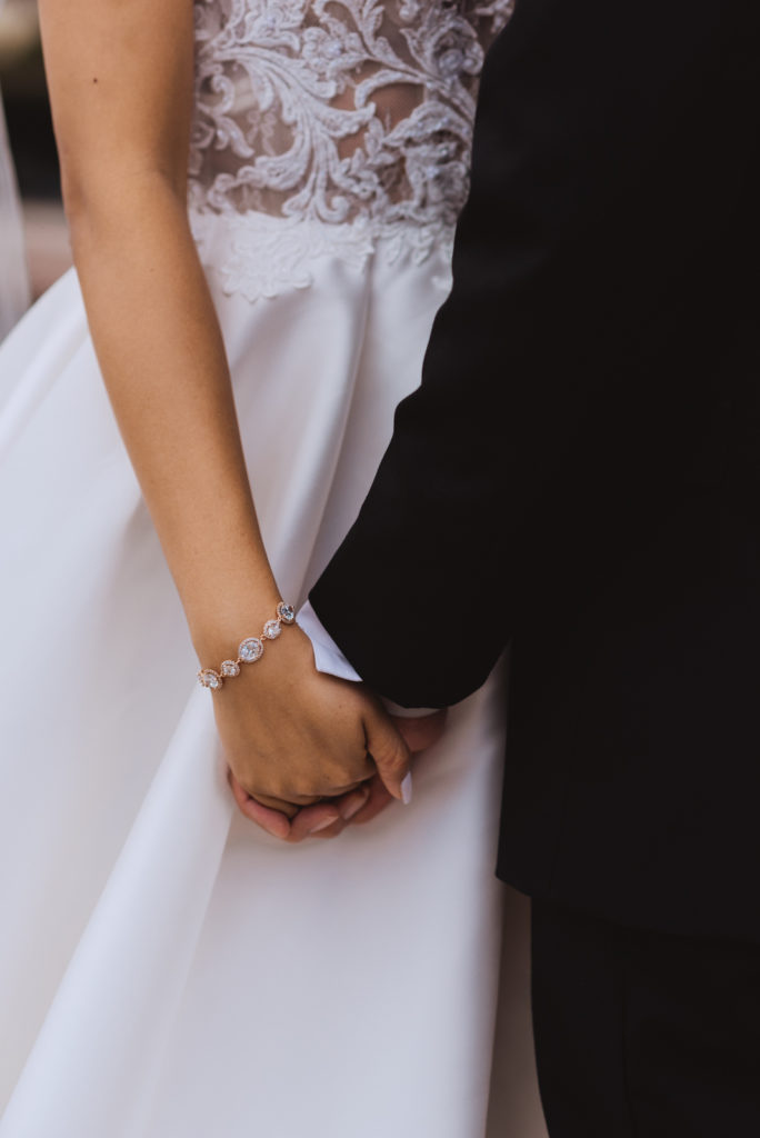bride and groom's hands together