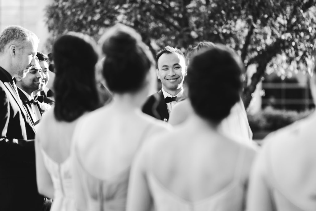 groom smiling during wedding ceremony