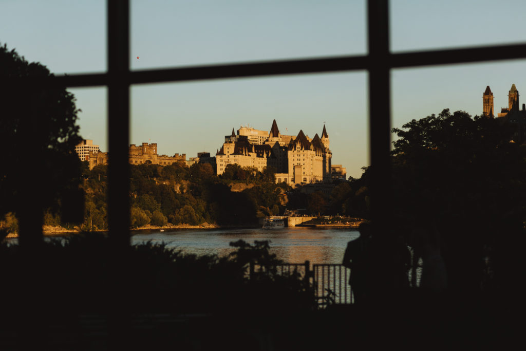 chateau laurier in the distance at sunset