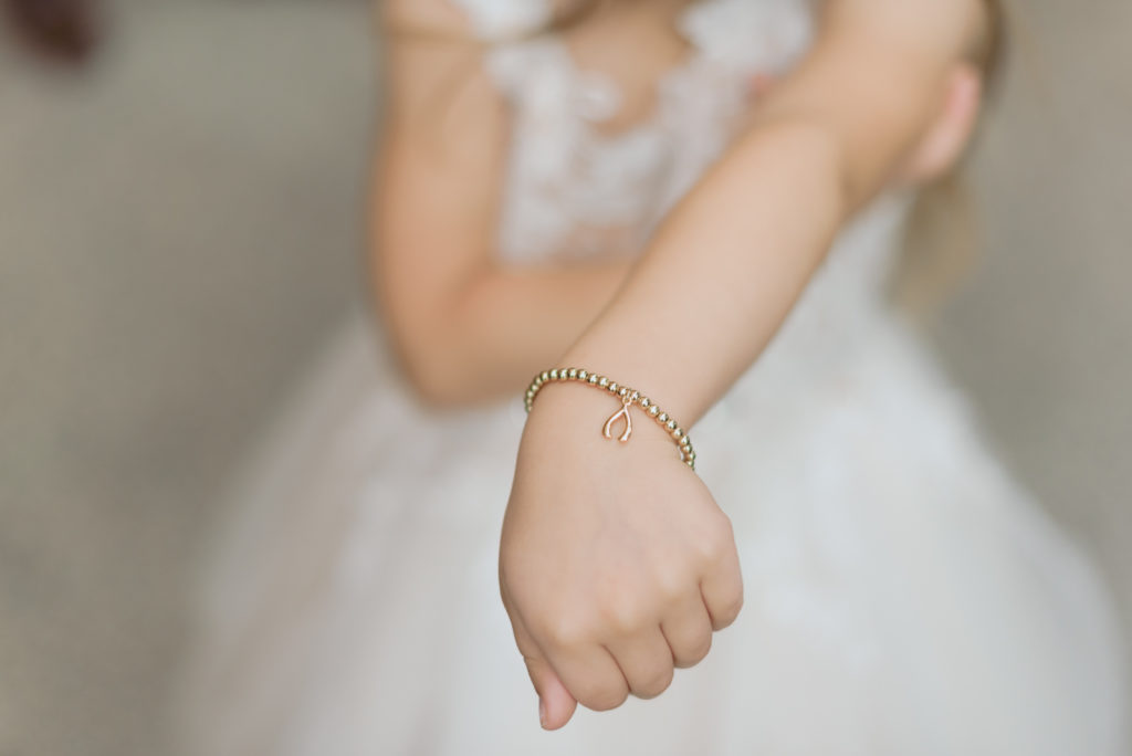 flower girl's wishbone bracelet from bride