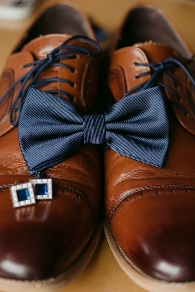 groom's shoes, cufflinks and bow tie
