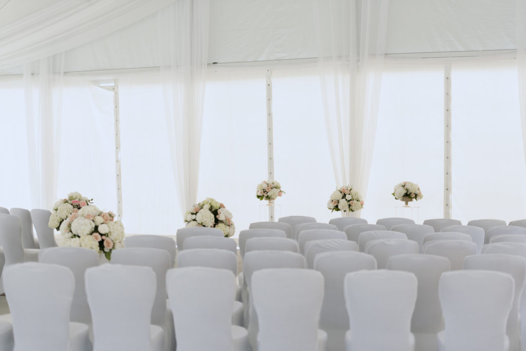 ceremony space underneath white tent
