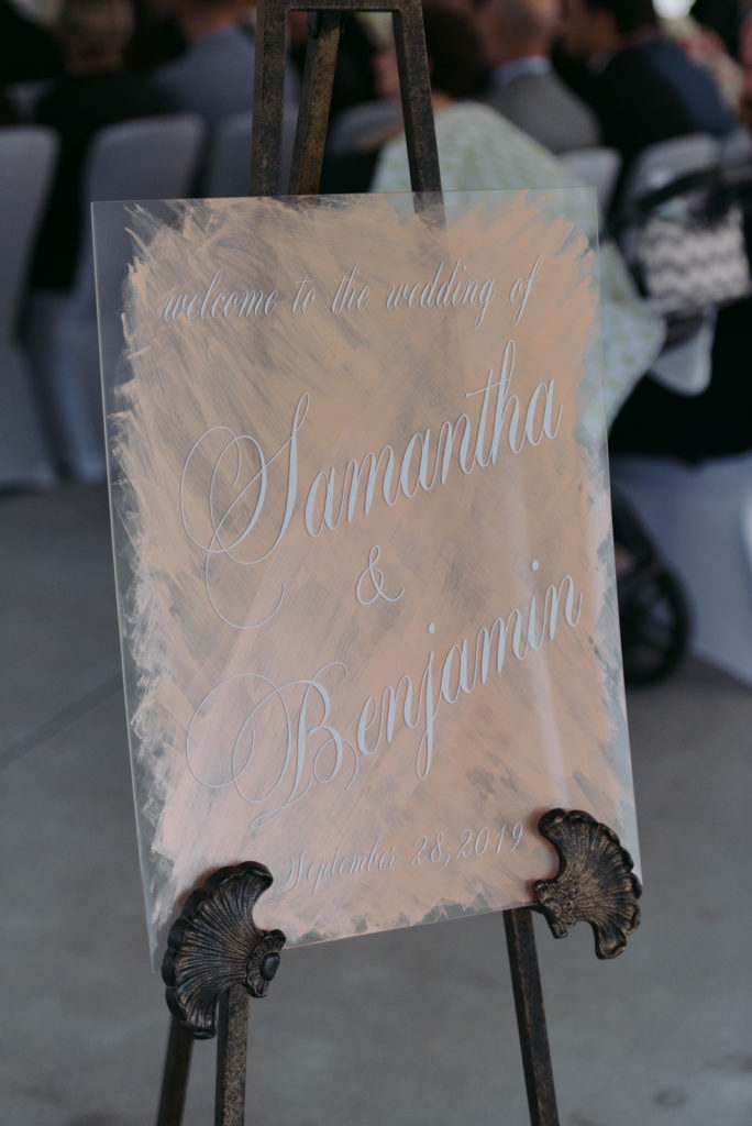 welcome sign at wedding on plexiglass