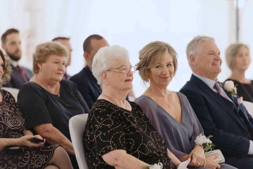 grandmother watching the bride and groom get married