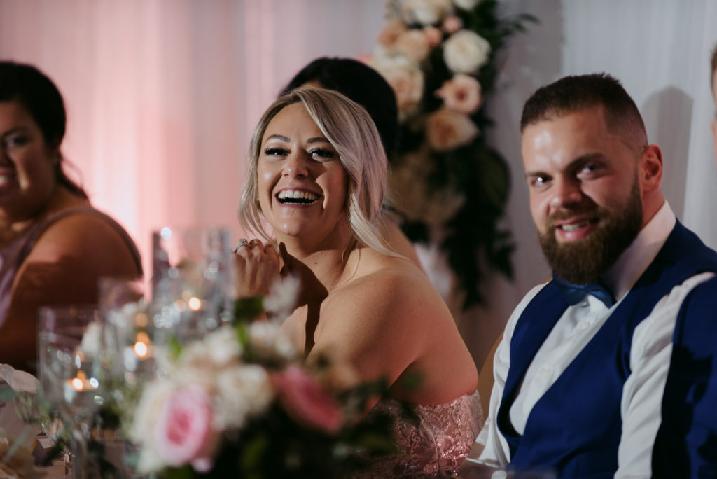 bride laughing during speeches