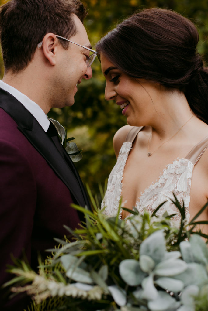 bride and groom laughing during fall wedding