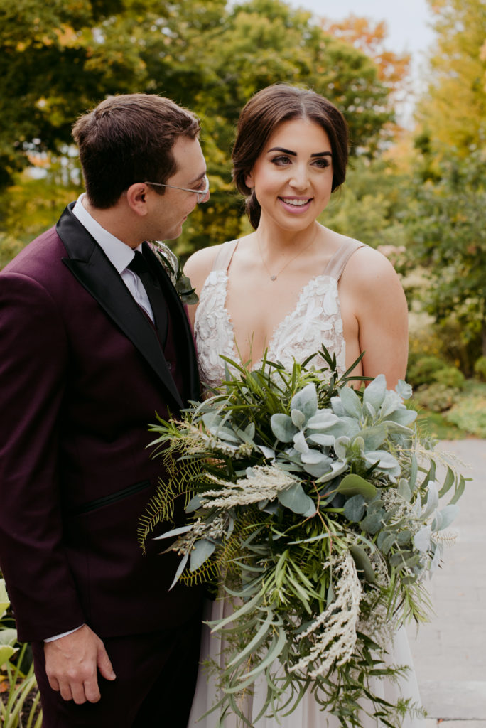 bride and groom smiling during fall wedding