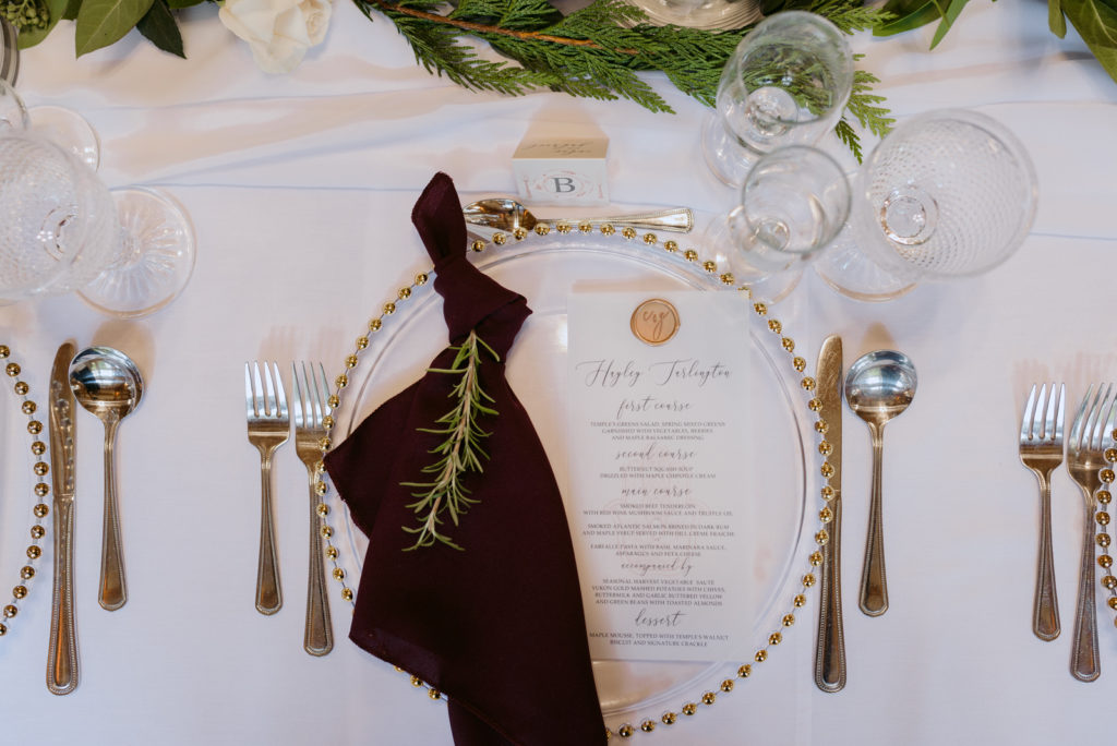 gold and marsala table setting at wedding