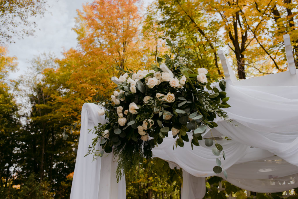 floral arrangement on wedding chuppah