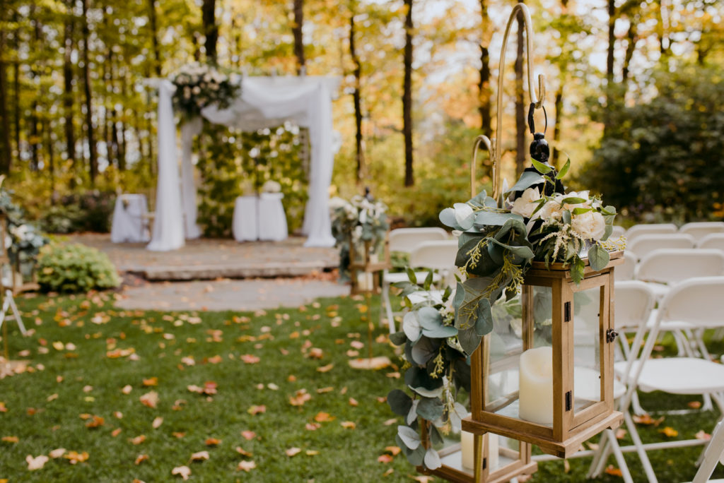 wooden lanterns at outdoor wedding ceremony