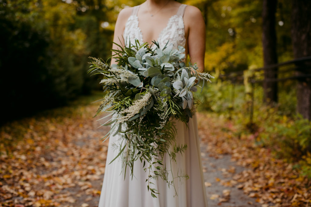 truvelle bride with wild green bouquet during fall wedding