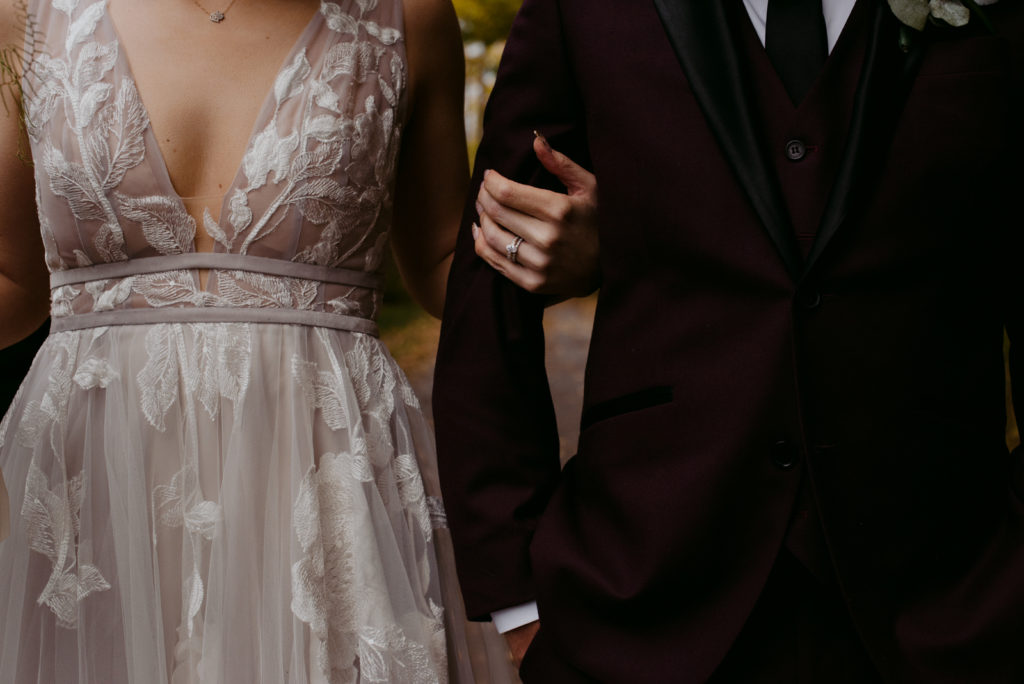 bride holding groom's arm