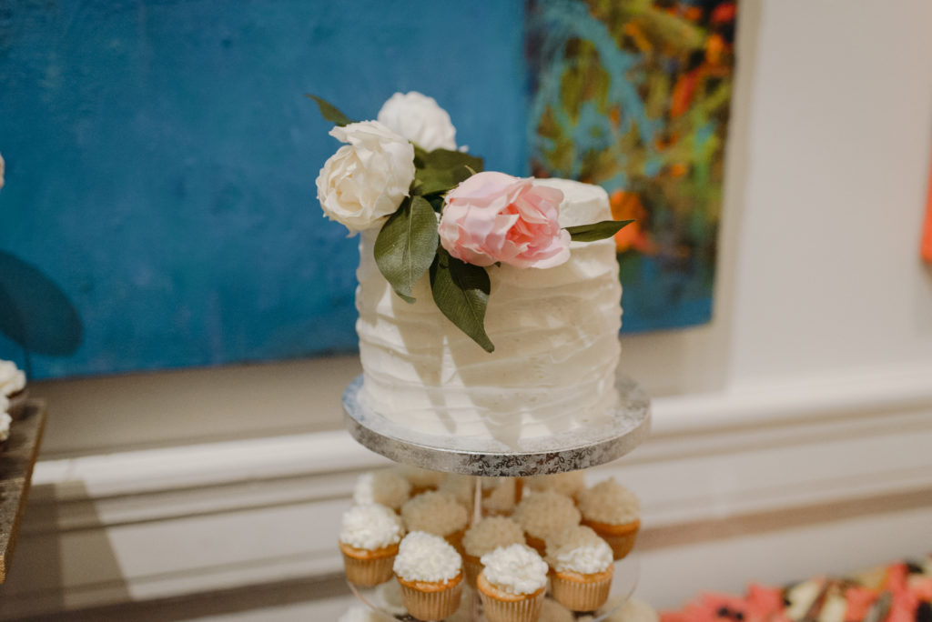 wedding cake on top of cupcake tower