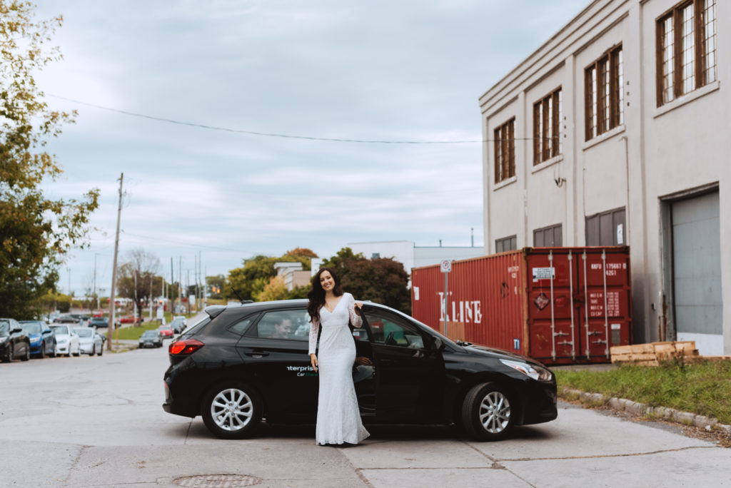 bride getting out of the car for first look with her groom
