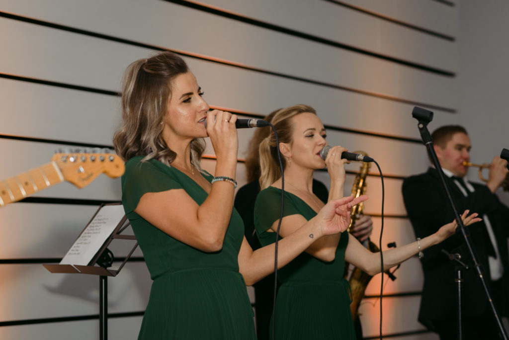 The Hornettes band singing at wedding