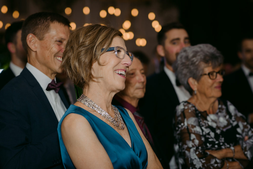 parents of the bride laughing at bride and groom speech