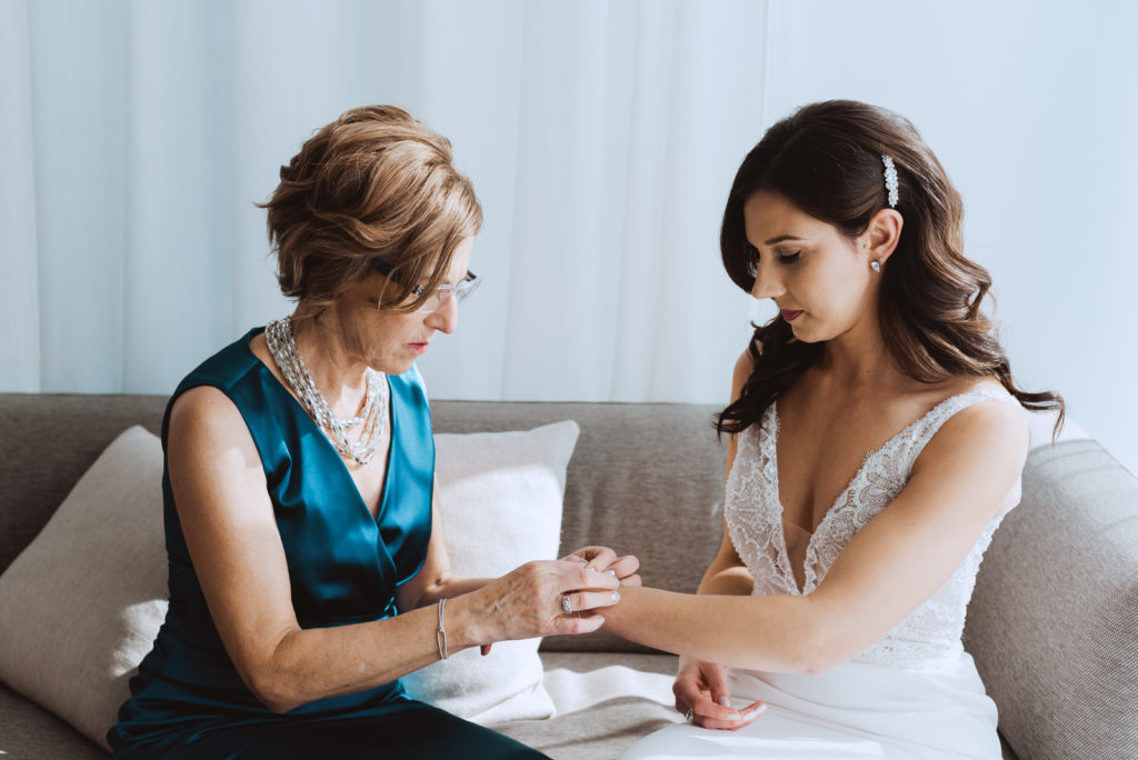bride's mother helping bride put on her new bracelet at the andaz hotel