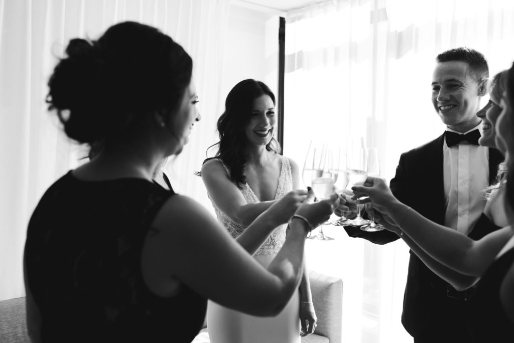 bride and bridal party cheers with champagne at the andaz hotel
