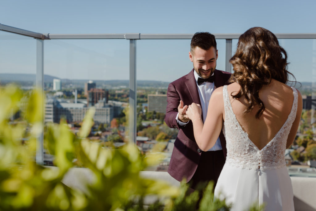 bride and groom first look on the andaz hotel rooftop