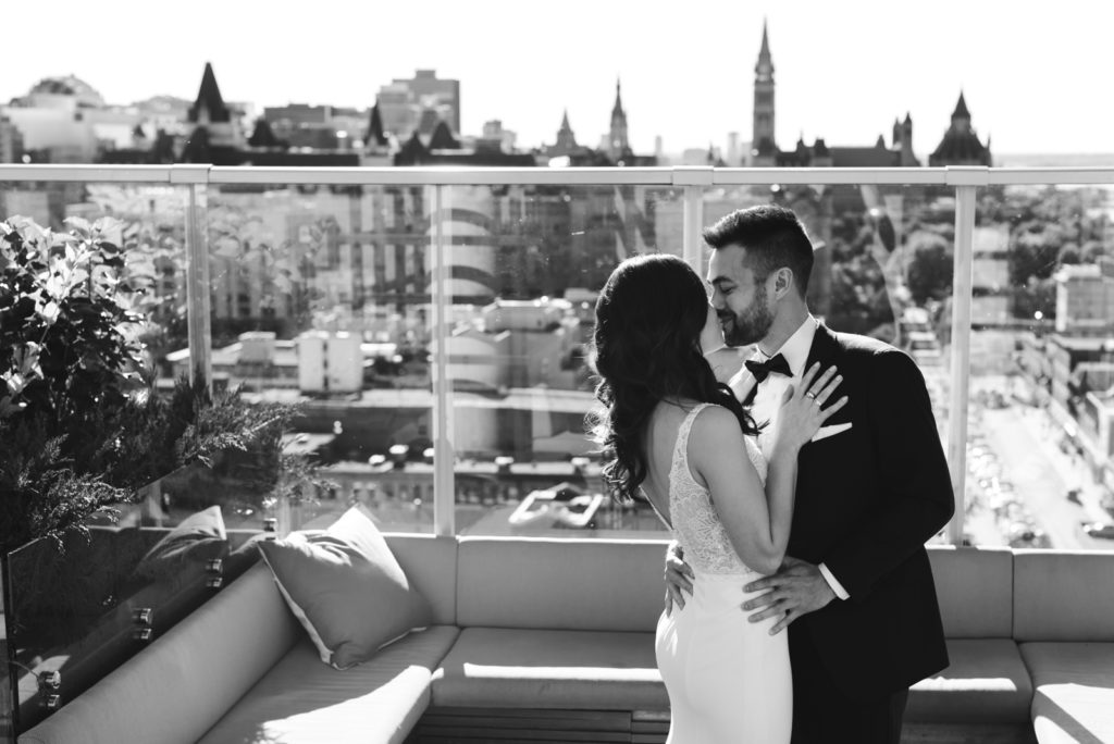 bride and groom first look on the andaz hotel rooftop
